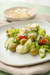Plate with fresh Greek salad, closeup