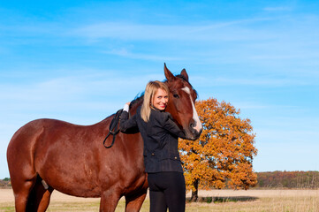 beautiful woman walking with horse