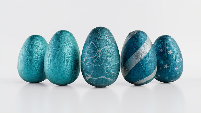 Easter Eggs isolated against a white background. Chocolate Eggs wrapped in patterned Teal and Silver foil. 3D Render