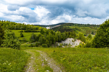 Fototapeta na wymiar Long mountain trail with beautiful landscape in Rudawy Janowickie