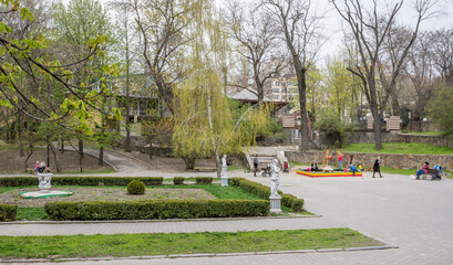  In the spring Gorky Park citizens walk and rest on the benches