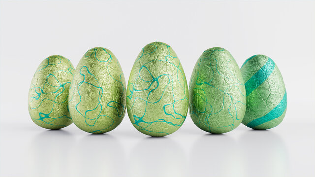 Easter Eggs isolated against a white background. Chocolate Eggs wrapped in patterned Green and Aqua foil. 3D Render