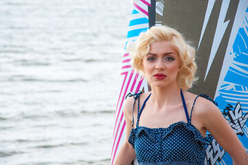 model like Marilyn Monroe with surfing board