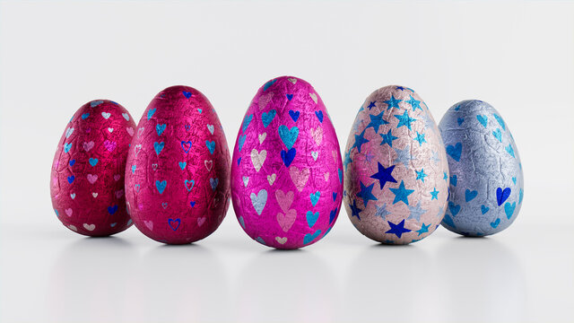Easter Eggs isolated against a white background. Chocolate Eggs wrapped in patterned Pink, Blue and Silver foil. 3D Render