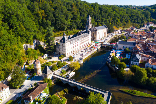 Aerial view of small French town of Brantome en Perigord on banks of bend in Dronne overlooking Town hall in summer