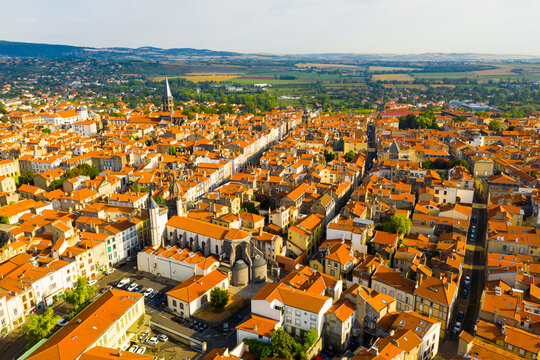General aerial view of French commune of Riom on summer day, Puy-de-Dome, Auvergne, France
