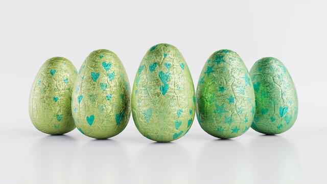 Easter Eggs isolated against a white background. Chocolate Eggs wrapped in patterned Green and Aqua foil. 3D Render