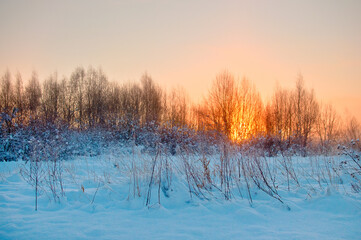 Sunrise amid cold winter landscape