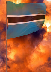 Botswana flag on pole with sky background