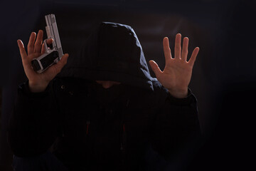 Detention of the offender. The terrorist is caught. The man with the pistol raised his hands up.