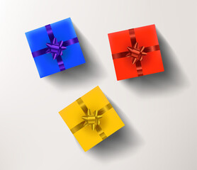 Yellow, red and blue gift boxes isolated on white background