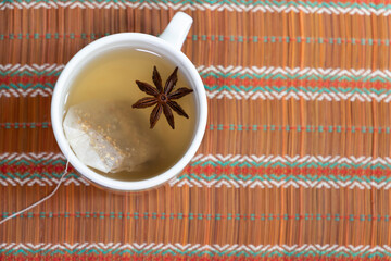 ginger-infused cup with a star anise