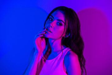 Photo of sensual beautiful stunning good looking young lady posing on camera isolated on neon blue color background