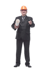 An architect wearing a hard hat and holding plans