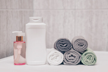 Shampoo large tube, rose oil to soften hair and towels in the bathroom.
