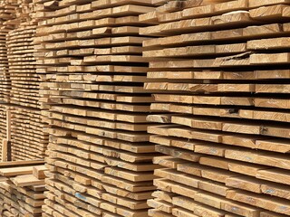 Close up of wooden boards. Texture of industrial natural timber building materials on building site.