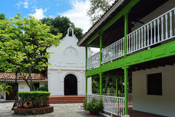 Fototapeta na wymiar Colonial style chapel and house