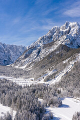 Fototapeta na wymiar Aerial view of Ski Jump in Planica, Slovenia at Ratece near Kranjska gora in winter with snow.