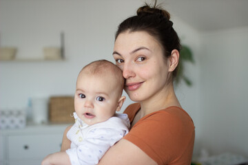 Mom plays with her baby. Little handsome boy and his mom. Happy childhood. Motherhood and childcare. Happy mother's day.