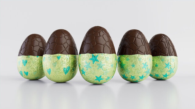 Easter Eggs isolated against a white background. Partially unwrapped Chocolate Eggs with patterned Green and Aqua foil. 3D Render