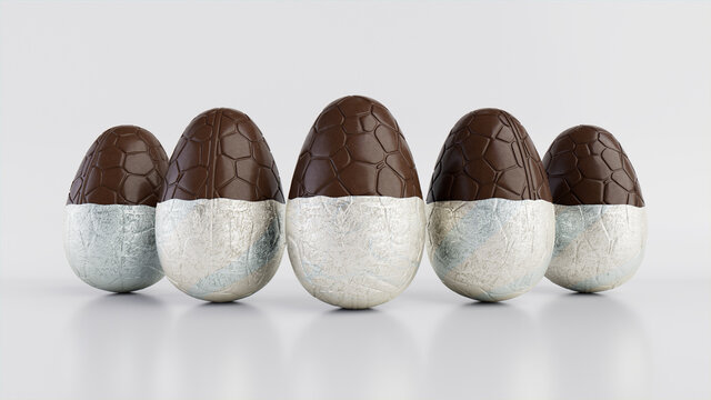Easter Eggs isolated against a white background. Partially unwrapped Chocolate Eggs with patterned Silver foil. 3D Render