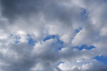 The sky after the storm. Sunlight shines through heavy gray storm clouds.