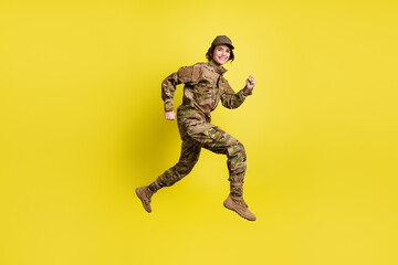 Fototapeta na wymiar Full body profile photo of charming carefree person hurry beaming smile isolated on yellow color background