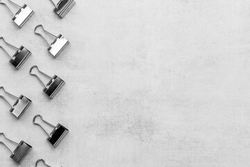 Stationery pattern, office supplies background. Paper binder clips top view