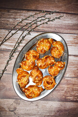 Sweet homemade baked buns called Juda's ropes with pussy willow