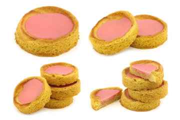 Traditional Dutch pink glazed cakes on a white background