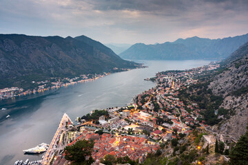 Fototapeta na wymiar Kotor Bay and Old Town illumiinated at dusk seen from St John's Fortress and hilltop,Montenegro,Eastern Europe.