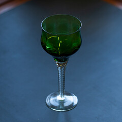 green vintage wine glass close-up. antique wine glass