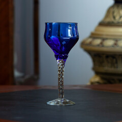 blue vintage wine glass close-up. antique wine glass