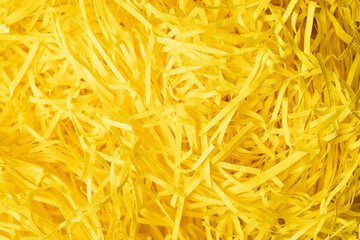 Brown decorative straws fillers for your product placement. Paper trash texture. Macro photography.