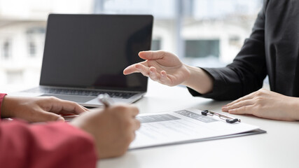 Fototapeta premium Job interview, Job applicants are talking about their abilities and past work experience to the staff, Testing the talent and skills of job applicants, Employment and selection concepts.