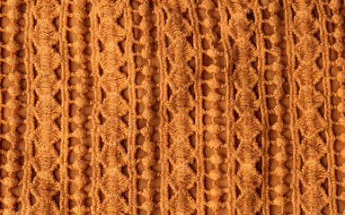 Macro of a woolen pattern textile . Detail of plain knitting