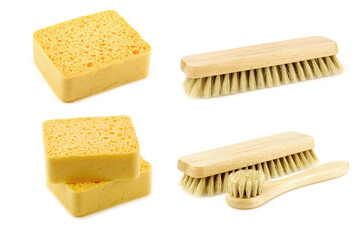 Wooden brushes and some household sponges on a white background