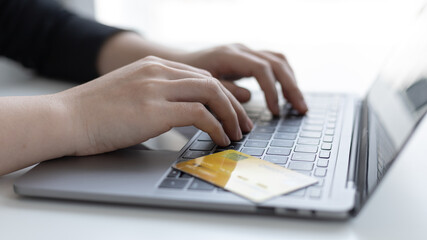 Online product purchase, Businesswoman use laptop register via credit cards to make online purchases, Shopping and mail, credit card online security, Online shopping concept.