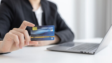 Online product purchase, Businesswoman use laptop register via credit cards to make online purchases, Shopping and mail, credit card online security, Online shopping concept.