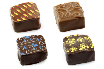 assorted decorated luxury chocolate bonbons on a white background