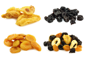 bunch of tutti frutti  and dried apricots, plums and apples on a white background