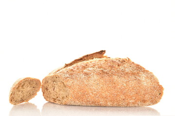 One half of a loaf of bread, close-up, isolated on white.
