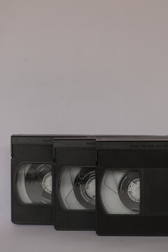 Three VHS Video Tapes, Cassette, isolated on white background. Vintage, Retro concept with tapes used in the past to play and record film and footage. copy space for text