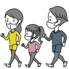 ウォーキングするマスクを着用した3人家族