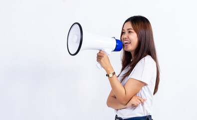 Smiling young Asian woman talking to the megaphone with standing over white background.
