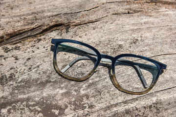 Clear eyeglasses, Glasses transparent dark blue frame Vintage style on grungy wood background