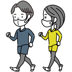 ウォーキングするマスクを着用したカップル