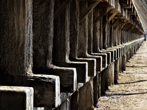 Old construction made of wooden logs, ..wooden logs covered with salt tarnish
