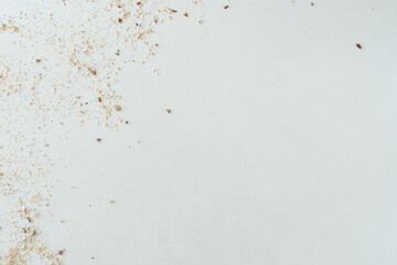 Flour texture with seeds. White surface.