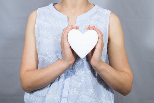 holding a heart in his hands